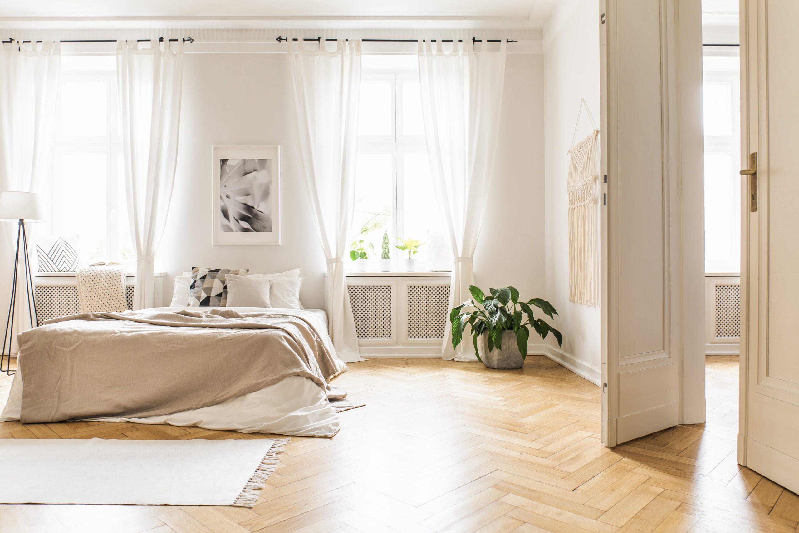spacious-and-bright-bedroom-interior-with-beige-de-34ZWJDF-min